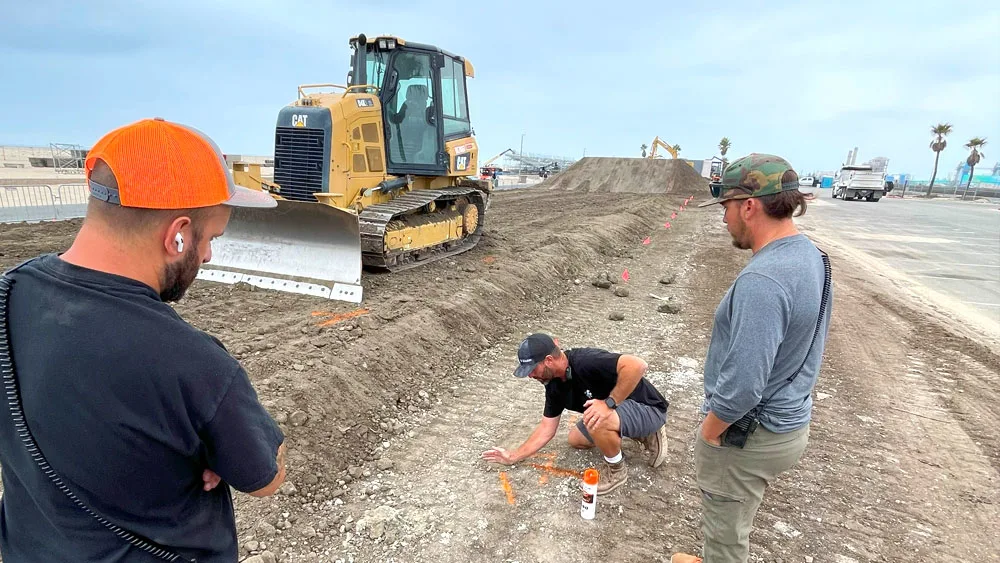 Men working on dirt track design
