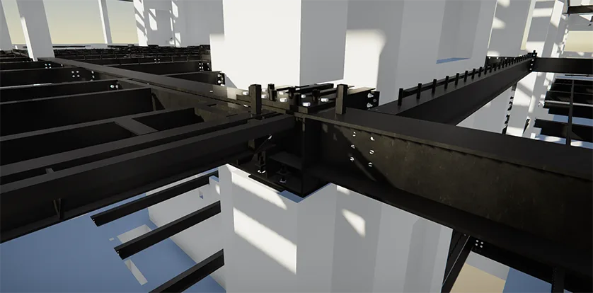 Close-up view of a steel frame structure, showing interconnected beams and columns with visible bolts.