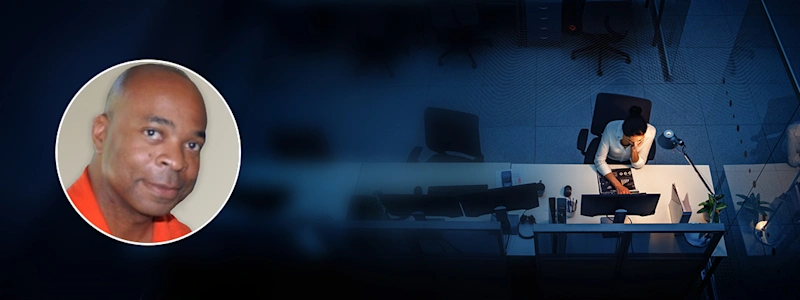 Portrait of Kevin Eison of Microsoft overlaid onto overhead image of a woman using a laptop at a desk.