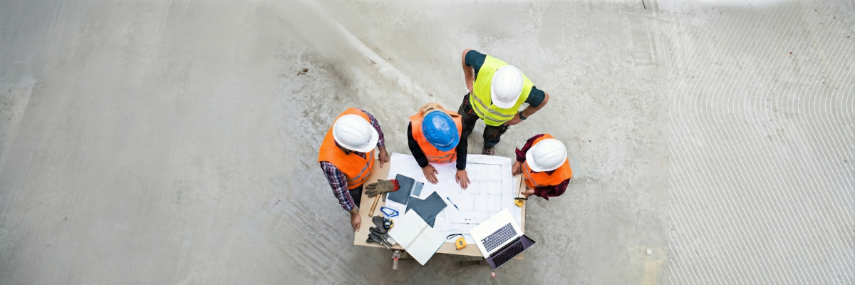 Construction team reviewing plans on site.