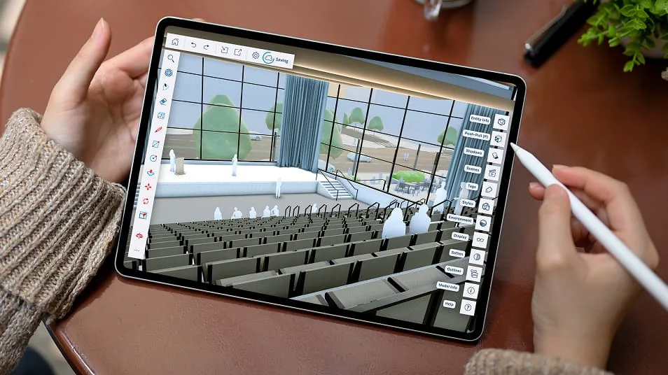 A person works on a 3D model of an auditorium in SketchUp on an iPad