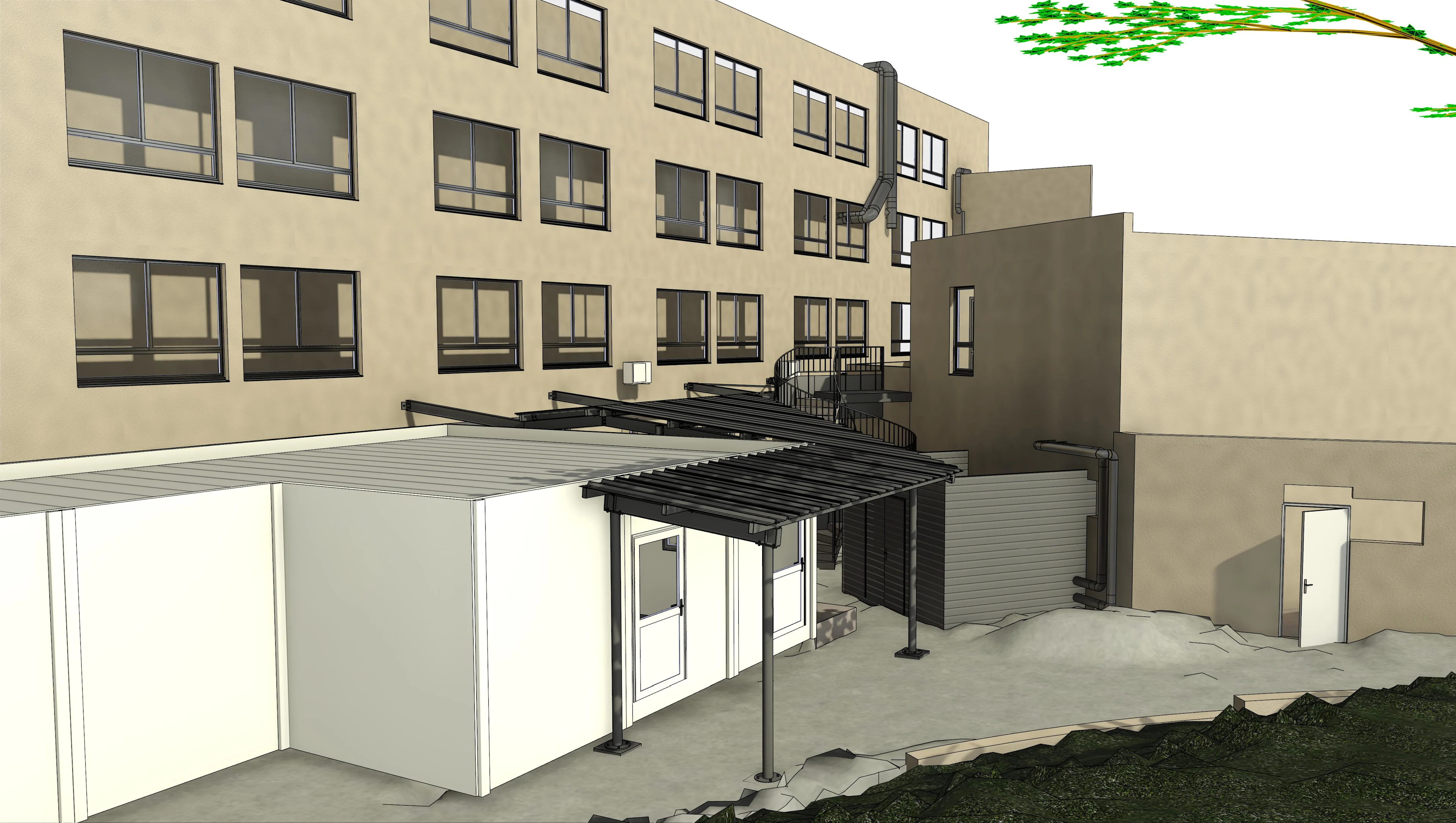 Exterior view of a modern building complex with a beige facade, multiple windows, and various attached structures including a white modular building.