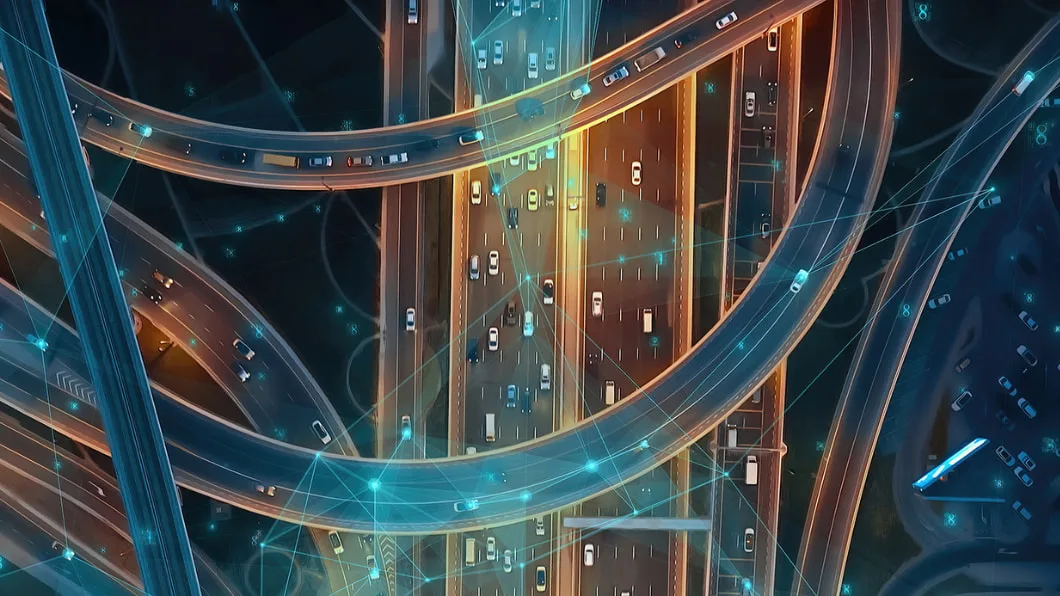 Autonomous cars navigate a complex highway cloverleaf with the help of satellite-based precise positioning.