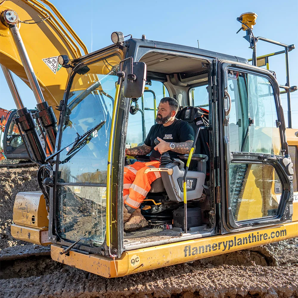 Lloyd Peckham and an excavator with Trimble Earthworks