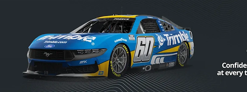 Side-angle view of Trimble car wrap with the logo and tagline "Confidence at every turn