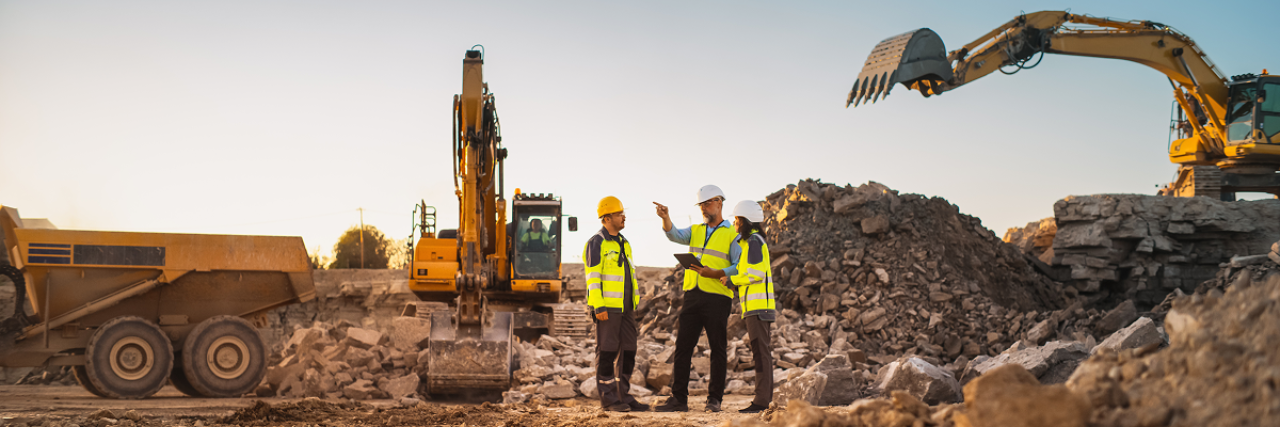 Construction professionals using tablets to review project data on the jobsite