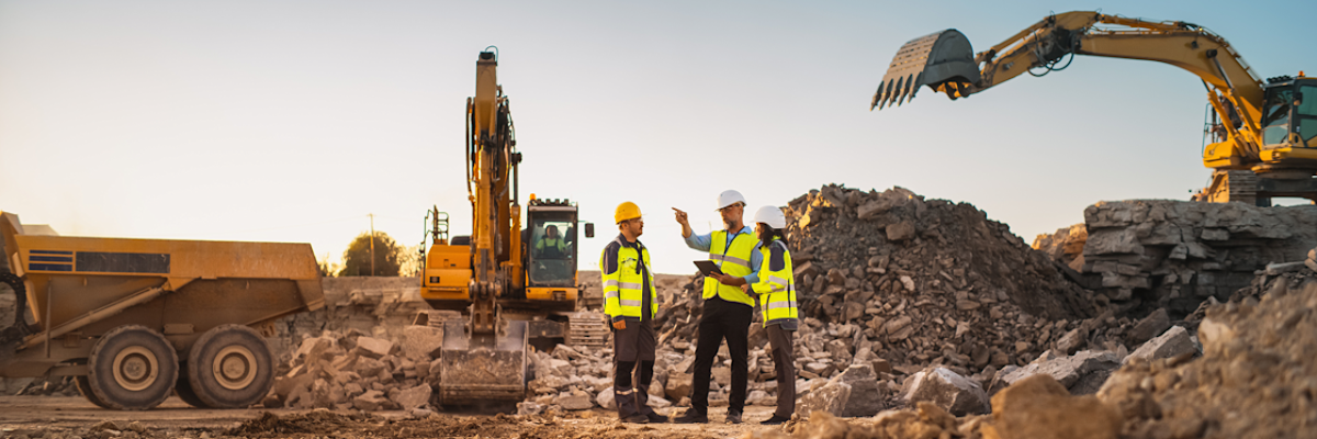 Construction professionals using tablets to review project data on the jobsite