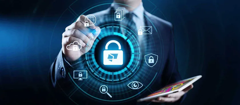 Man in a suit interacting with a holographic interface displaying security icons.