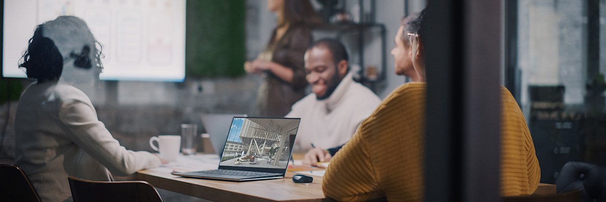 A diverse AEC design team seated around a conference table review a draft 3D model in SketchUp.