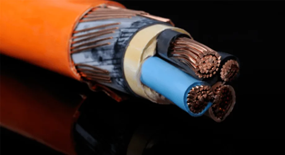 Close-up of a multi-conductor electrical cable with orange outer insulation and copper wiring.