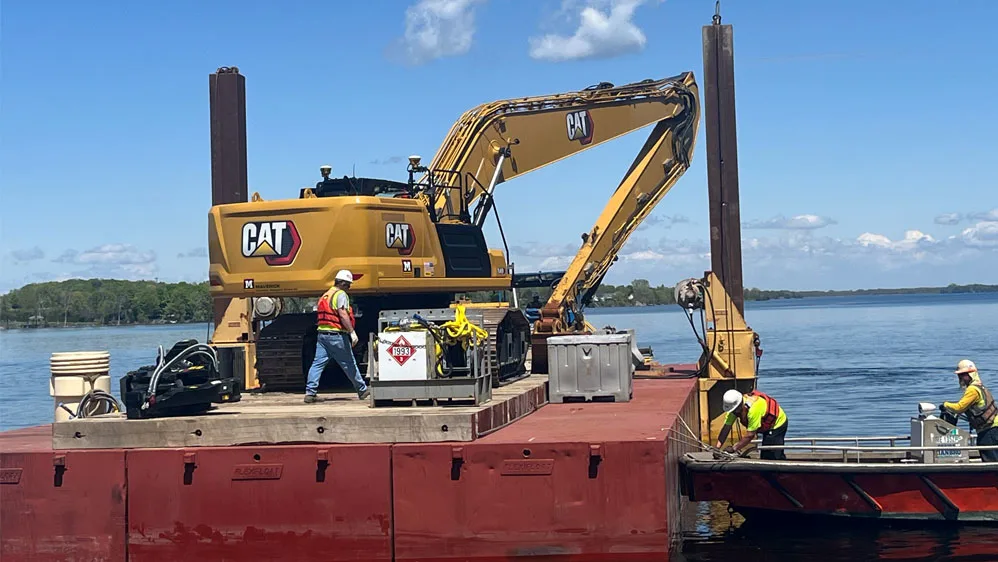 CAT excavator on barge