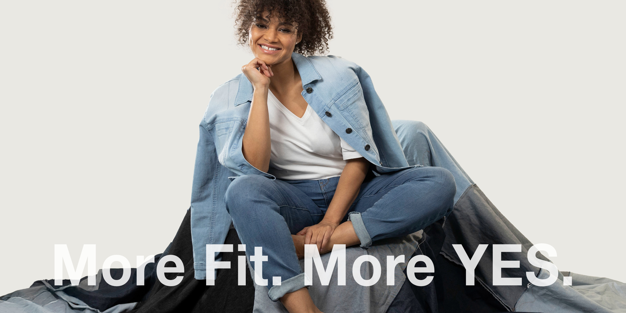 Banner mit sympathischem Model in Jeans und Text: More Fit. More YES.