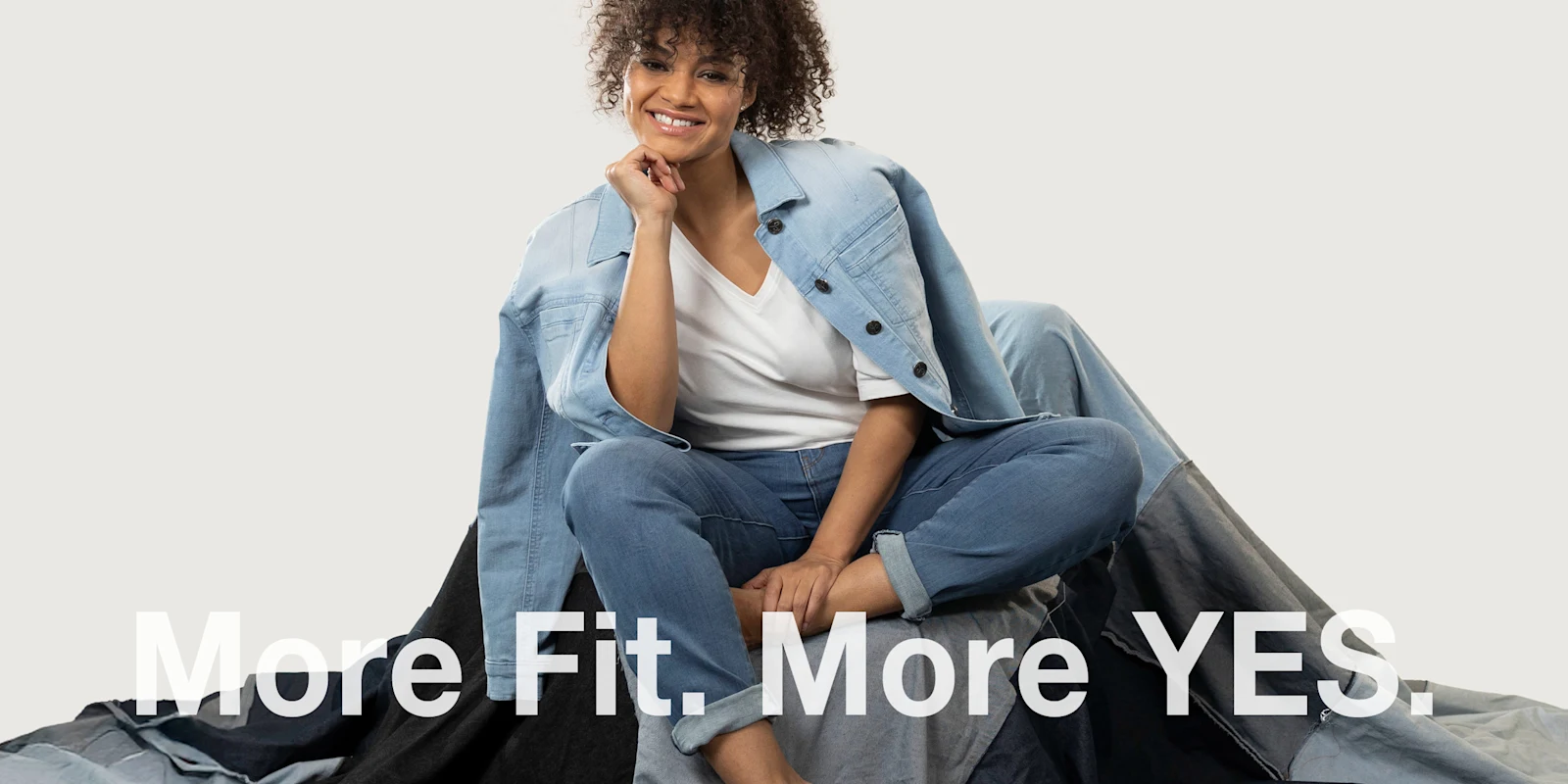 Banner mit sympathischem Model in Jeans und Text: More Fit. More YES. Banner mit sympathischem Model in Jeans und Text: More Fit. More YES.