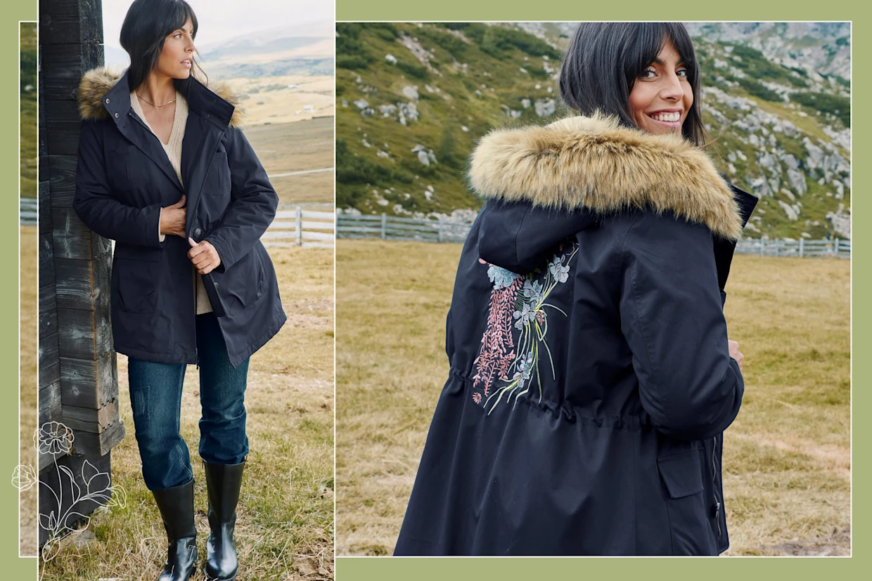 Model in schwarzem Parka mit buntem floralen Druck hinten und Fell-Imitat-Kapuze von sheego by Joe Browns Model in schwarzem Parka mit buntem floralen Druck hinten und Fell-Imitat-Kapuze von sheego by Joe Browns