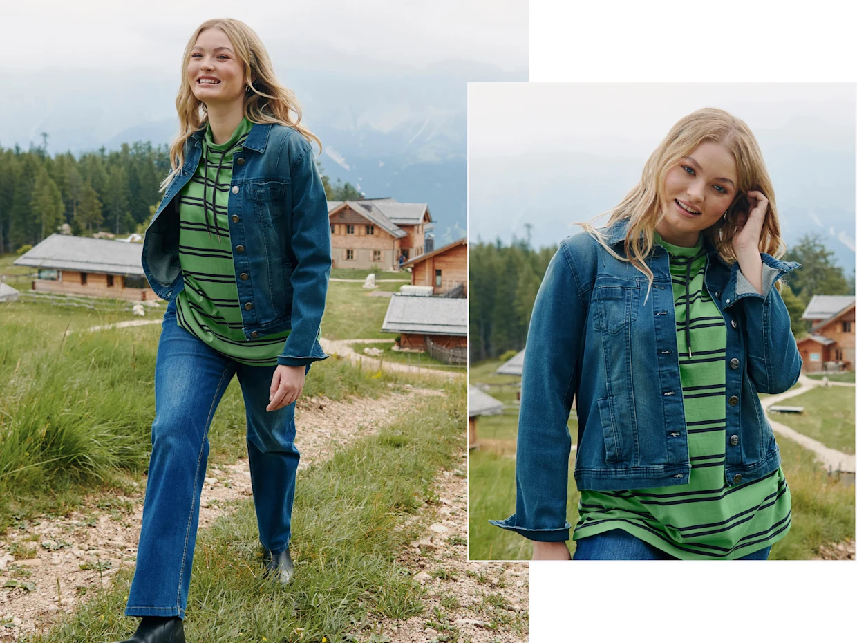 Zwei Abbildungen eines Models, die eine blaue Jeansjacke, grün-schwarz gestreiften Hoodie und blaue Jeans trägt, sie geht auf einem Weg in einer Berglandschaft mit rustikalen Häusern im Hintergrund.