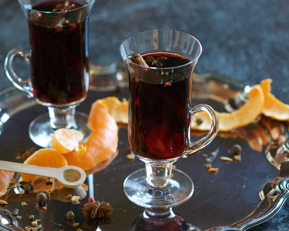 two glasses of mulled wine on a silver platter