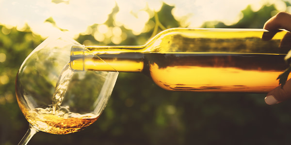 Pouring a glass of unoaked chardonnay
