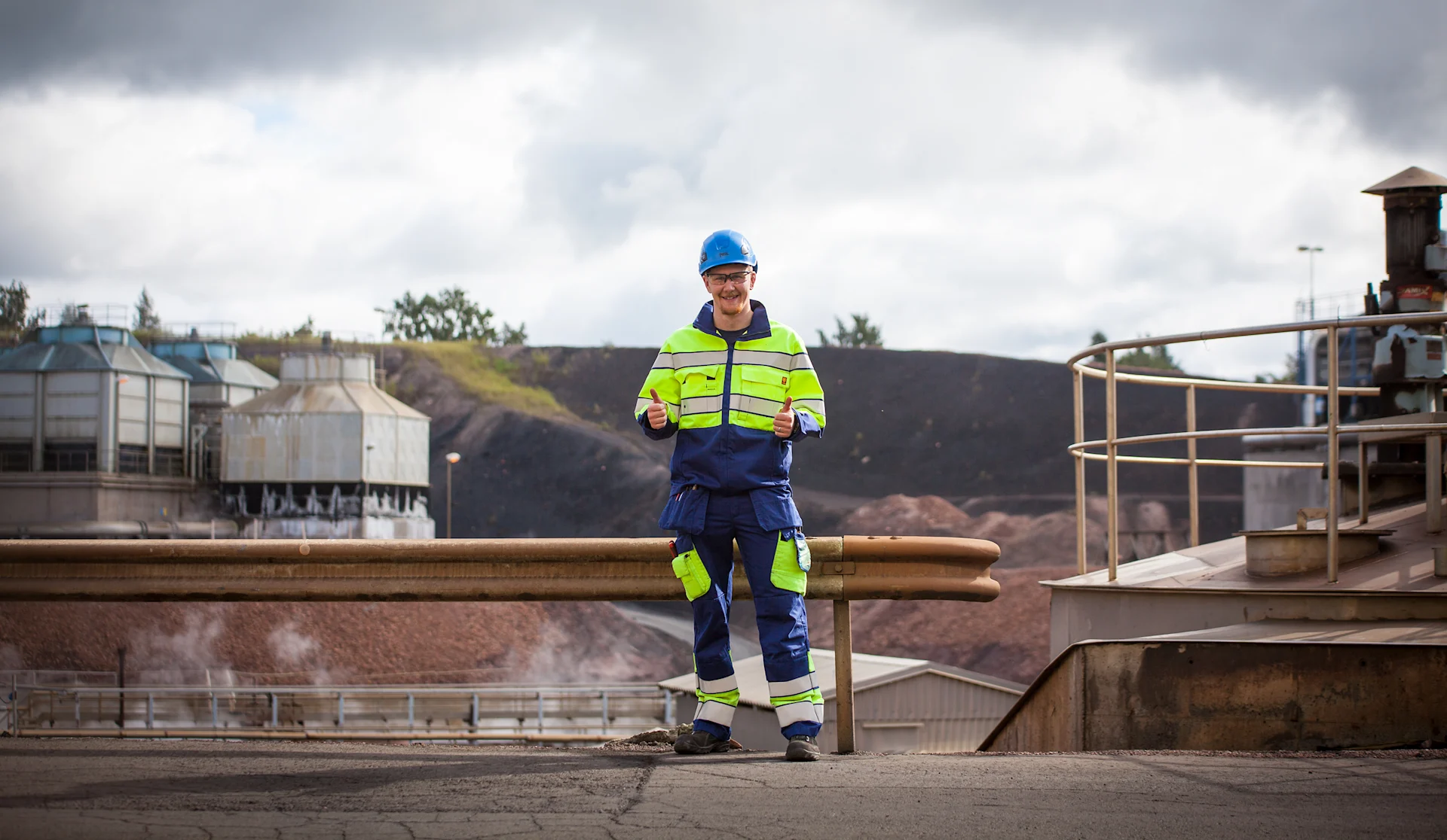 Industrial installation worker wearing protective equipment at a process industry site in Finland.