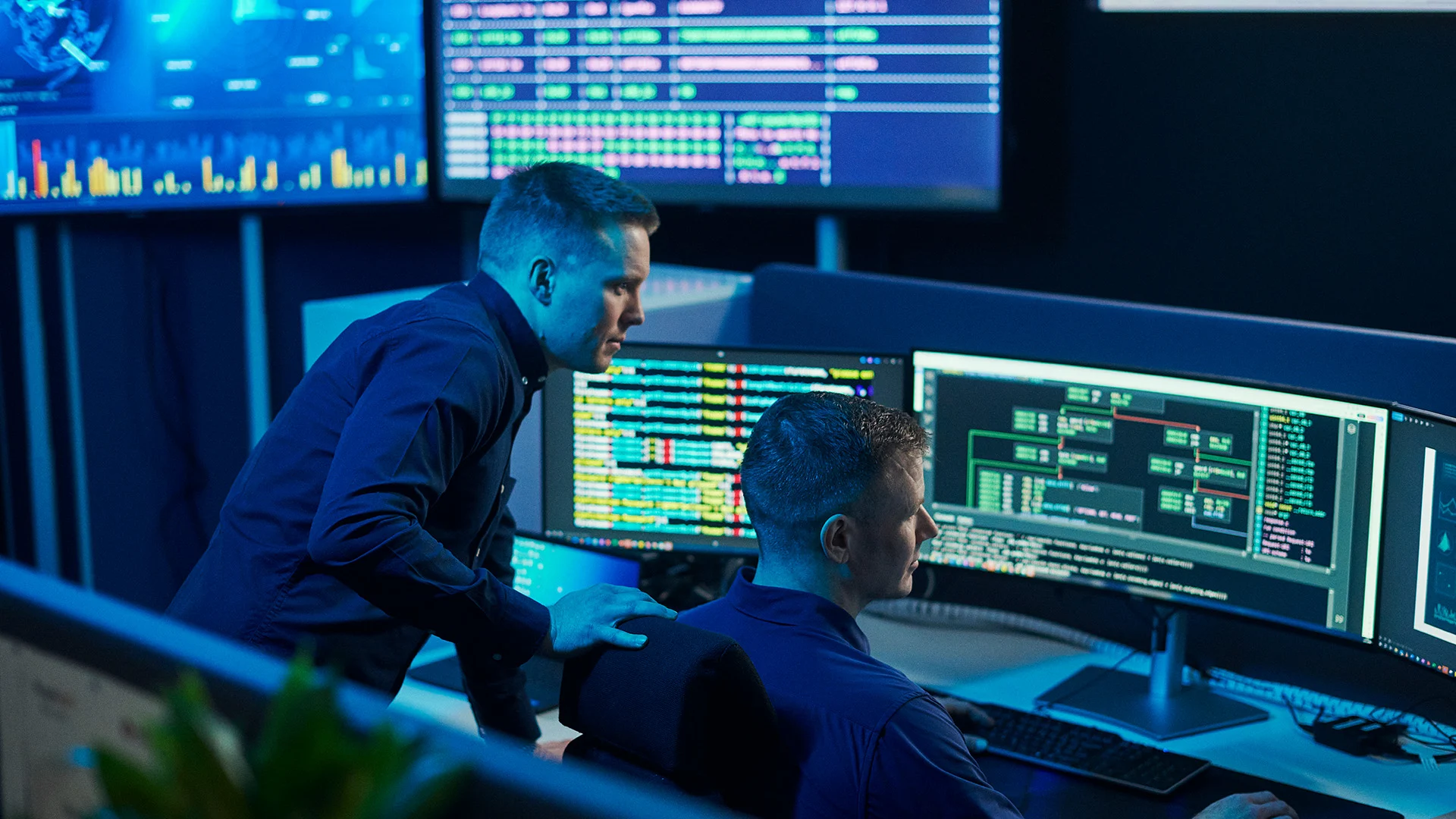 Insta experts working in front of multiple screens