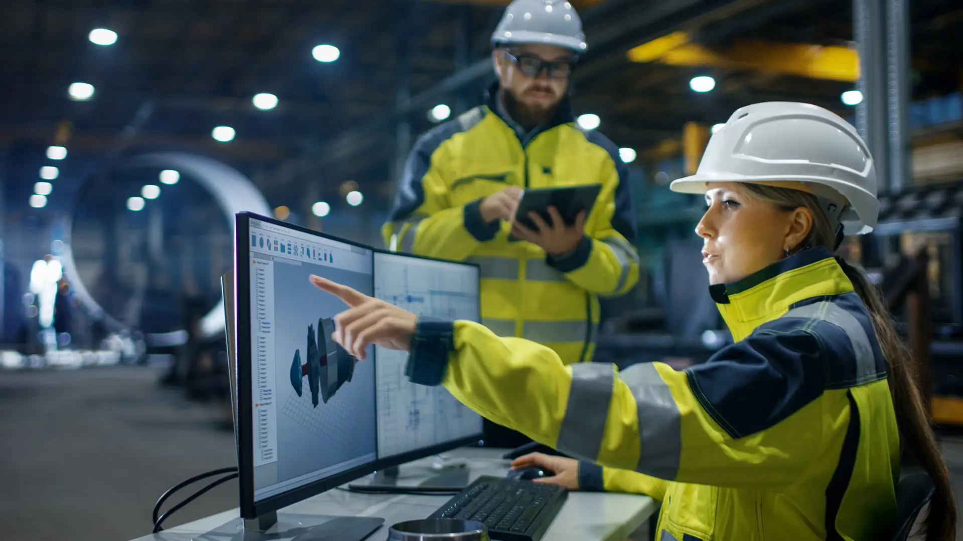 Factory workers at the screens