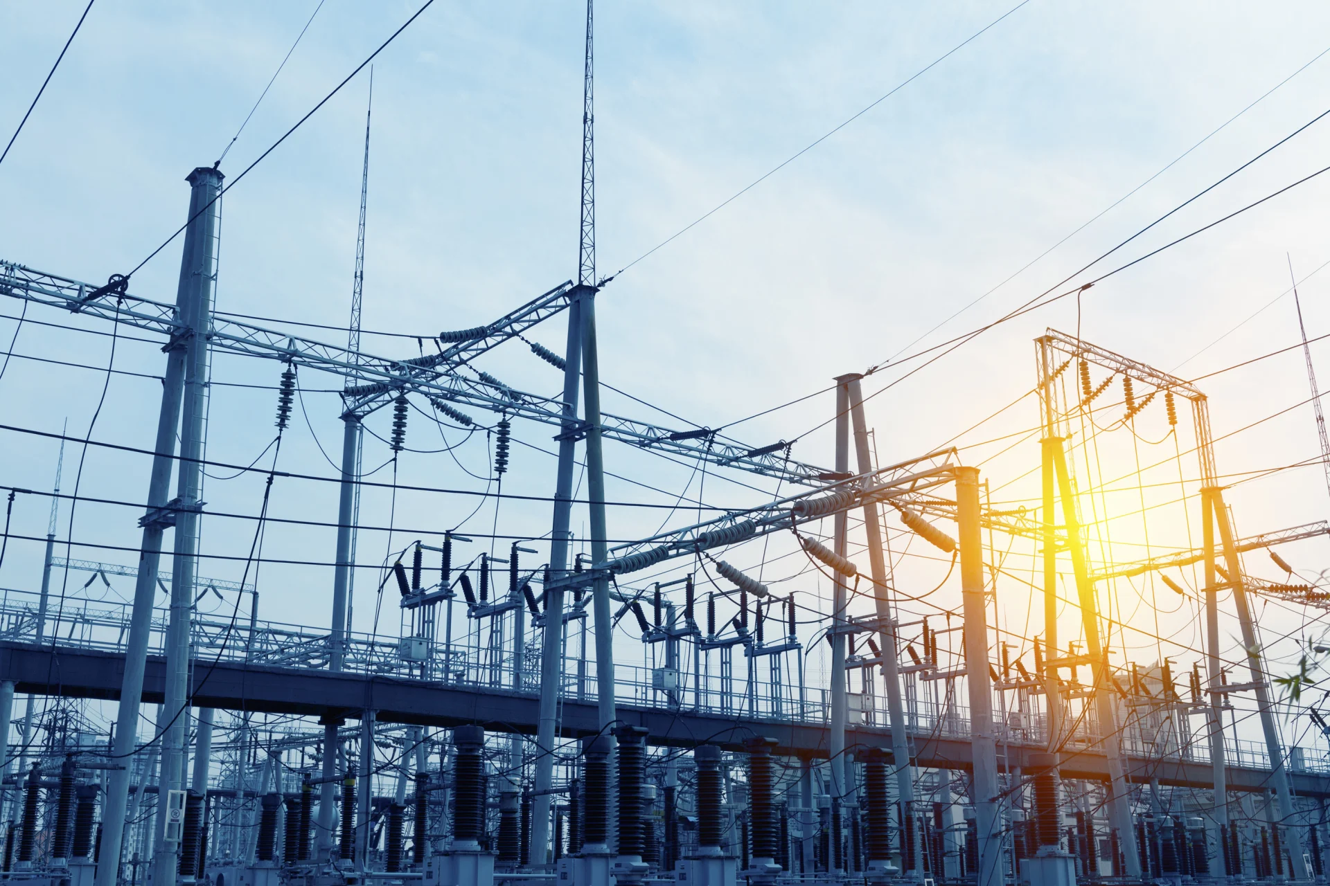 Transformer substation, the sun shines as a flare on the lens.