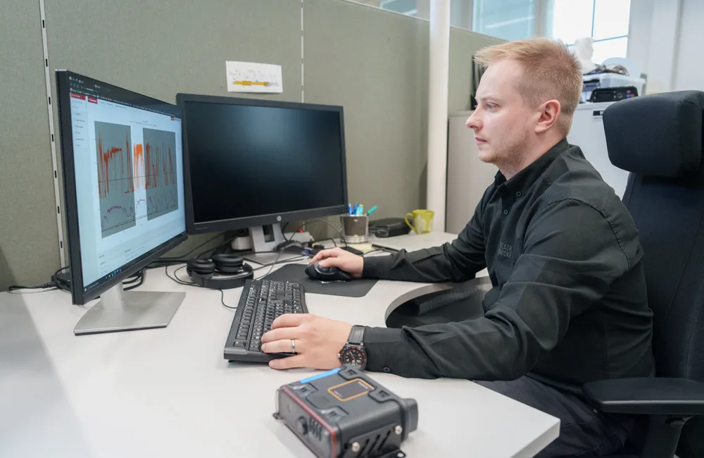 An employee using the data platform developed by AGCOPower and Insta