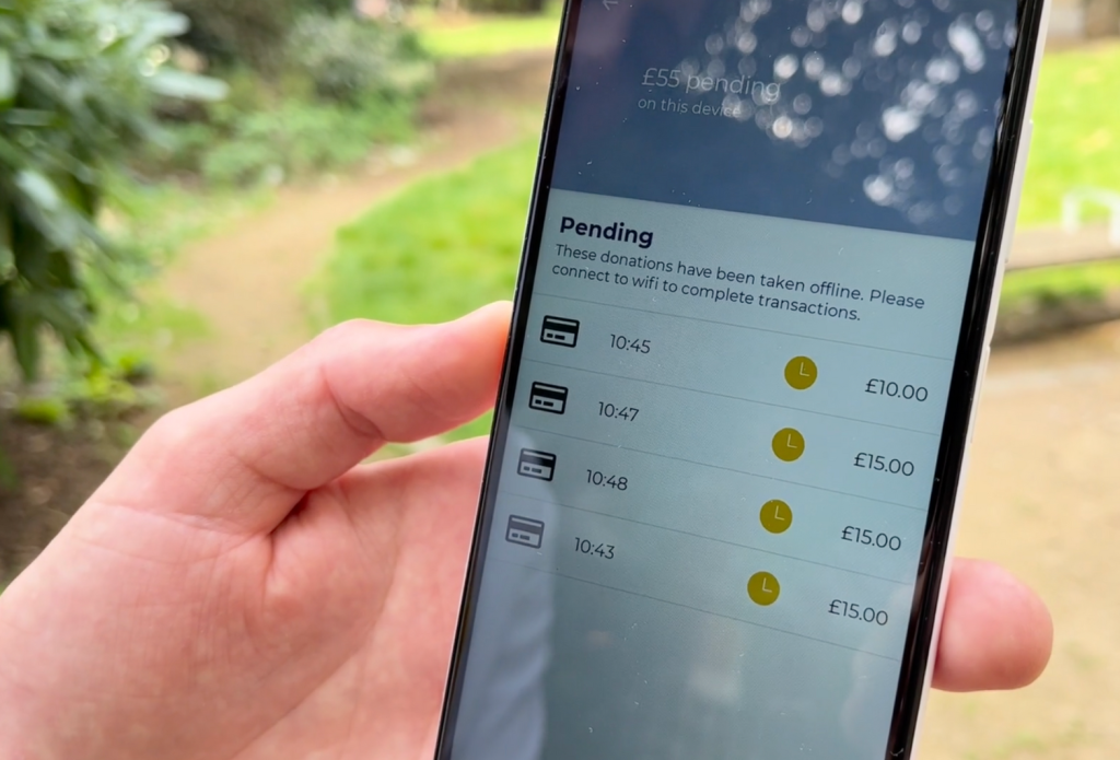 Photo of an Android smartphone showing the pending donations screen on the Give A Little app