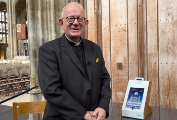 Revd Canon, Dr Mark Powell with Payaz GivingStation which uses Give A Little software to collect contactless donations