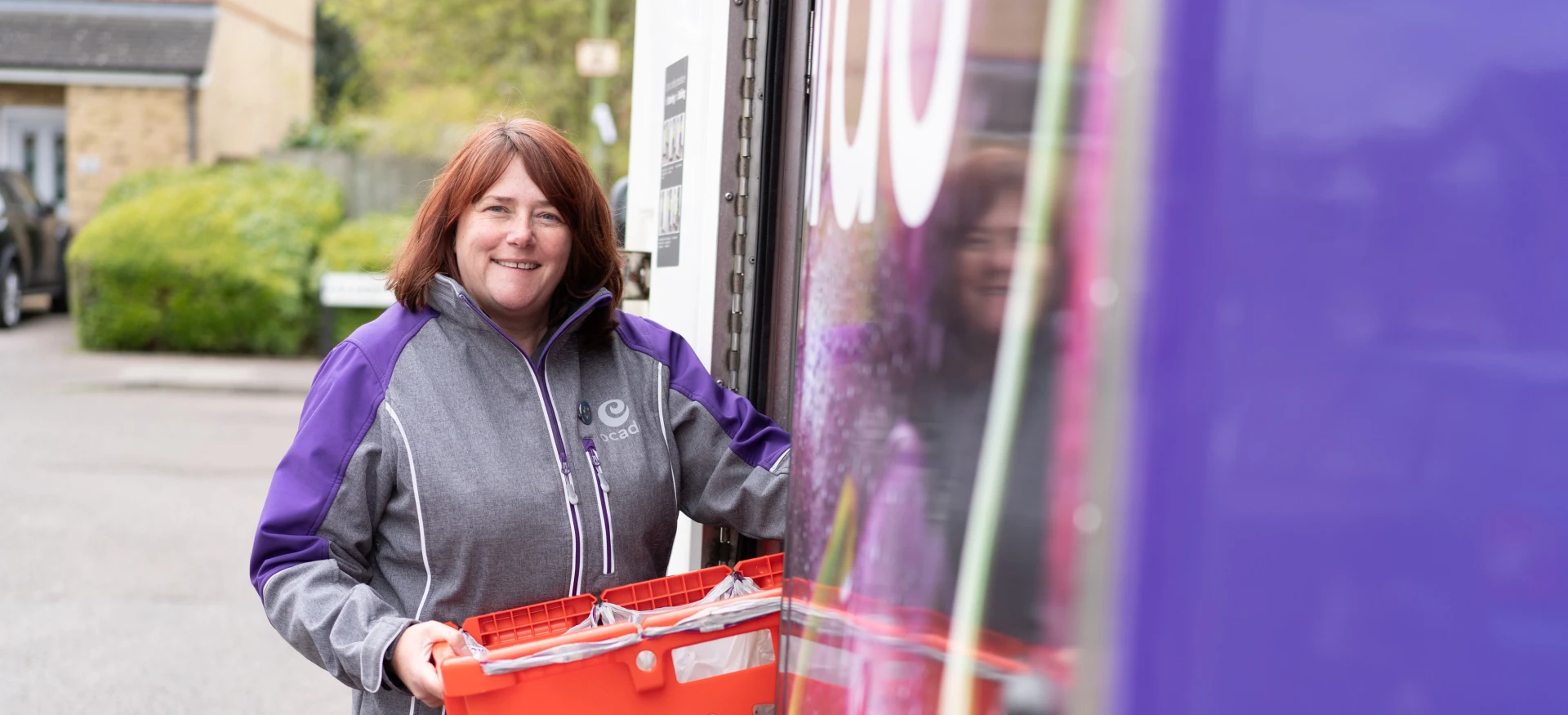 Delivery driver with her van