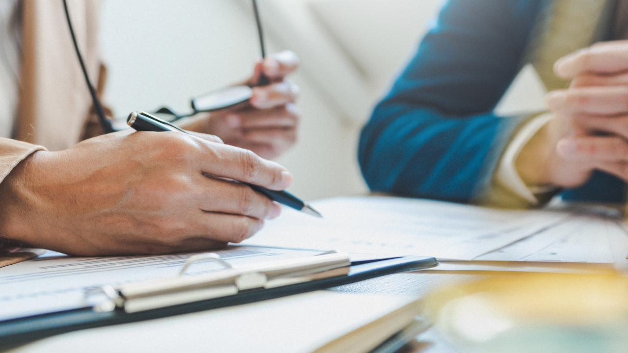 A lawyer and her client reviewing documents.