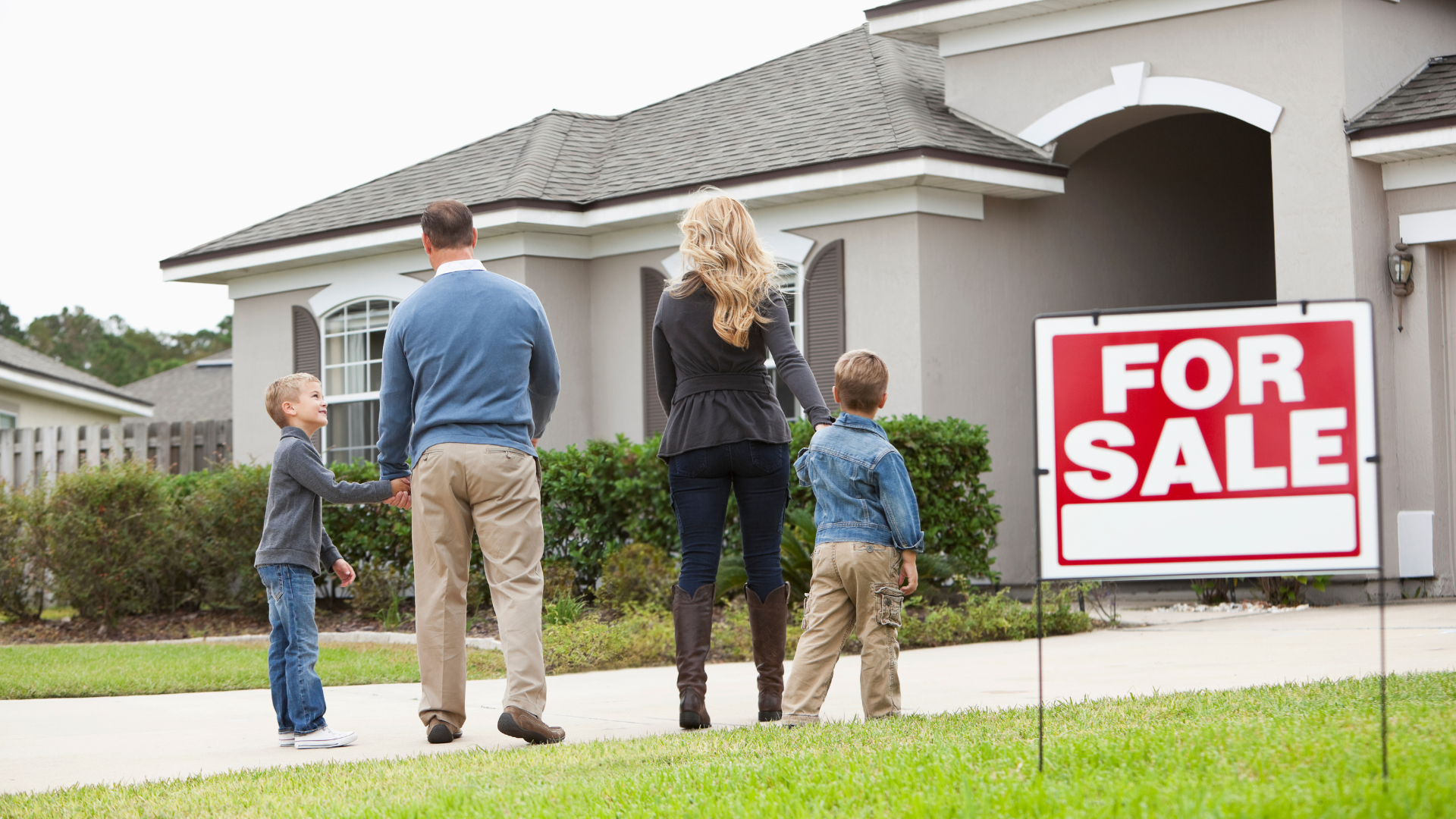 Real estate agent helping couple purchase new home