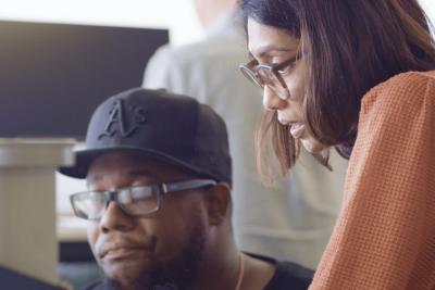 Two people collaborating together at a desk