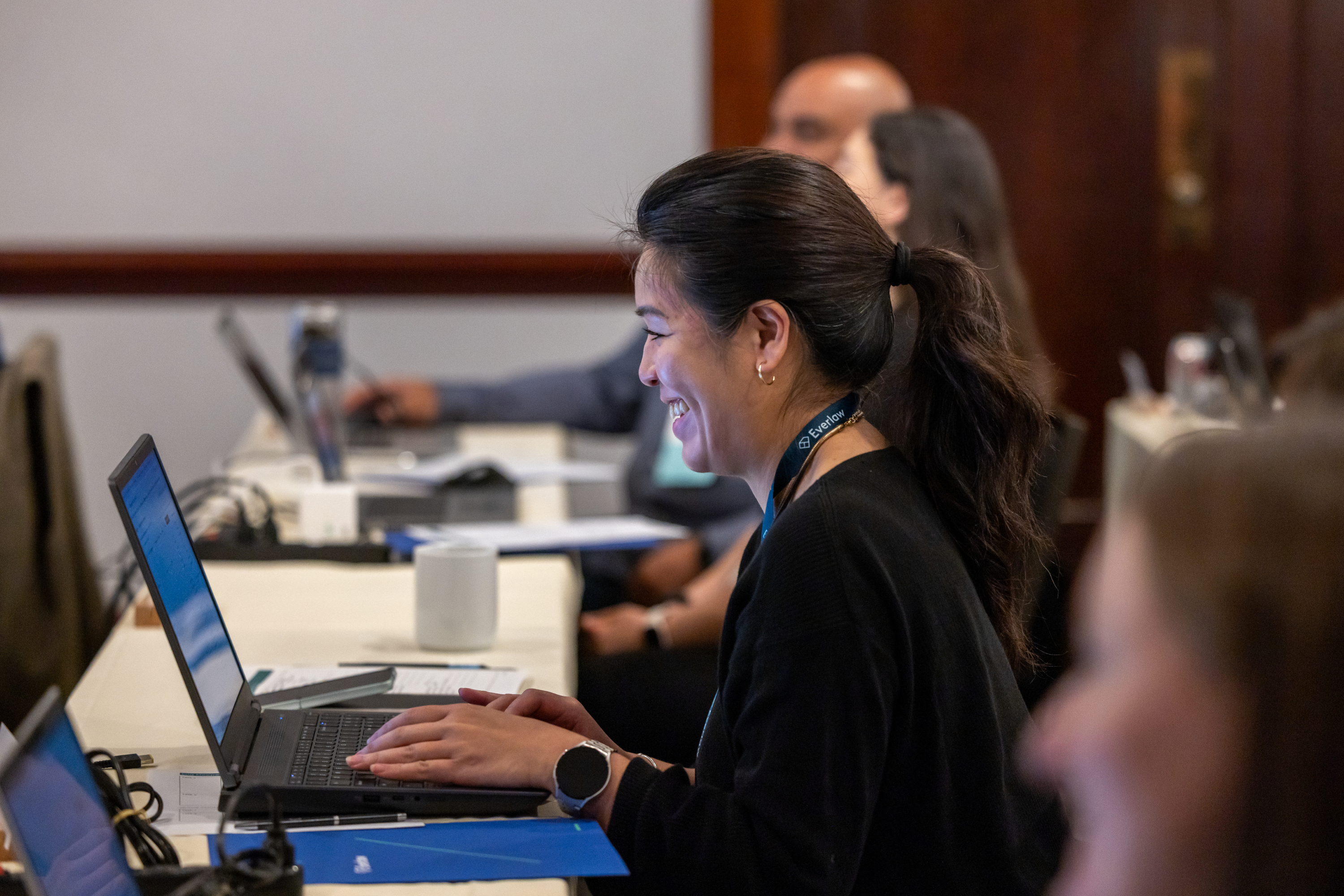 Woman Working at Laptop Summit 26