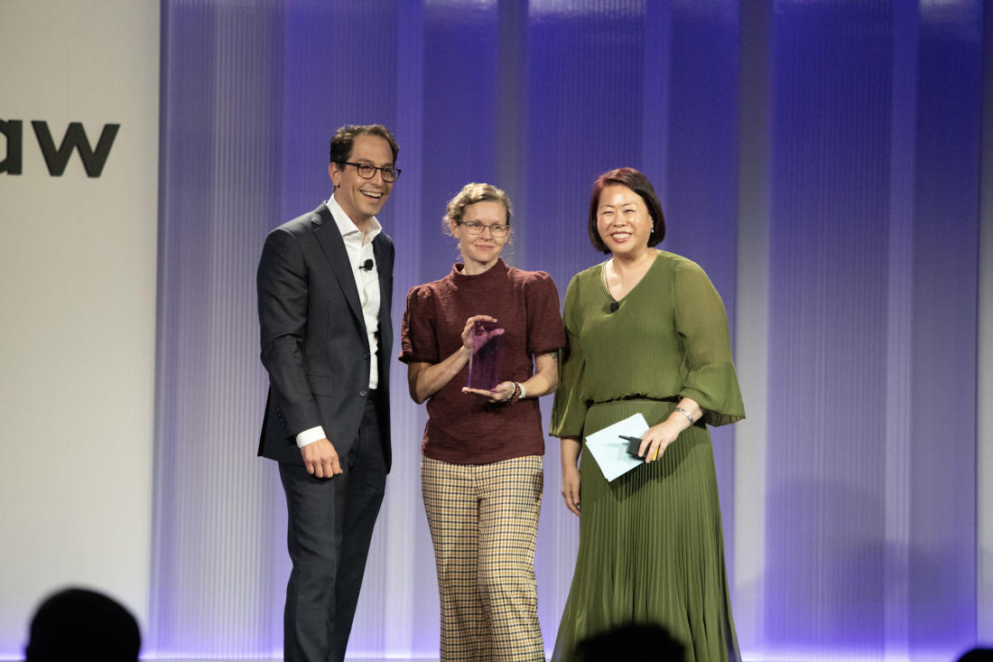 Dawne Herbert (center) is awarded Innovate Breakthrough of the Year for her work spreading predictive coding adoption at Seyfarth.