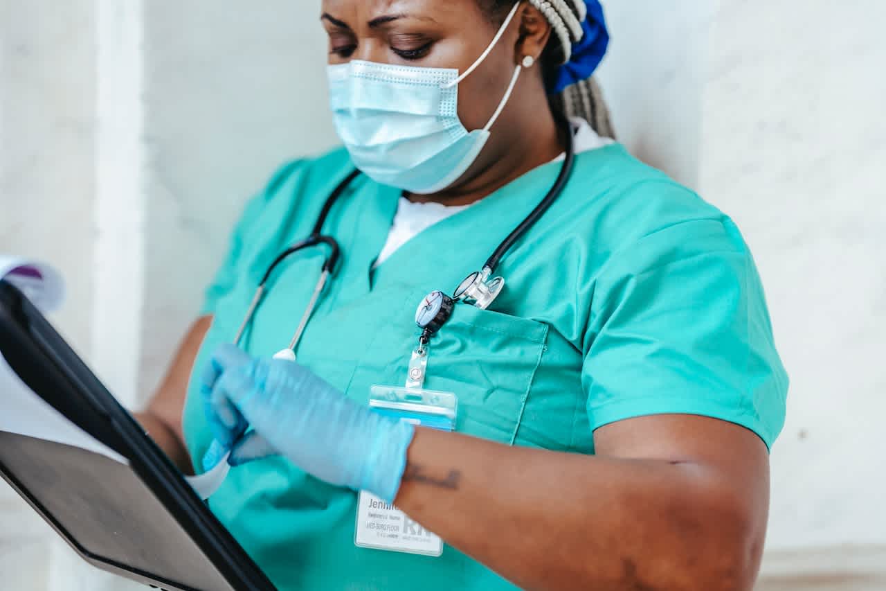 Female nurse in green scrubs