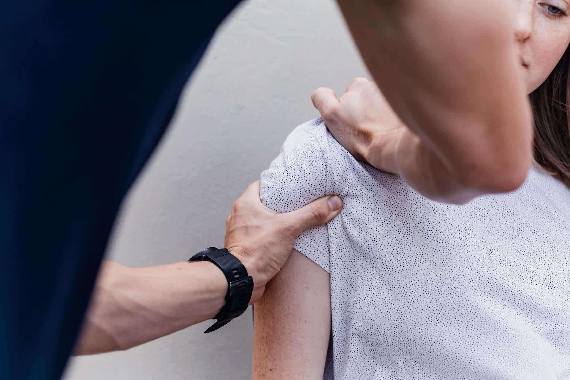 Physio working on a woman's shoulder