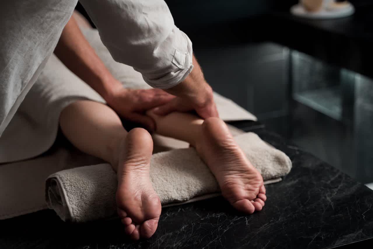 Massage on person's legs