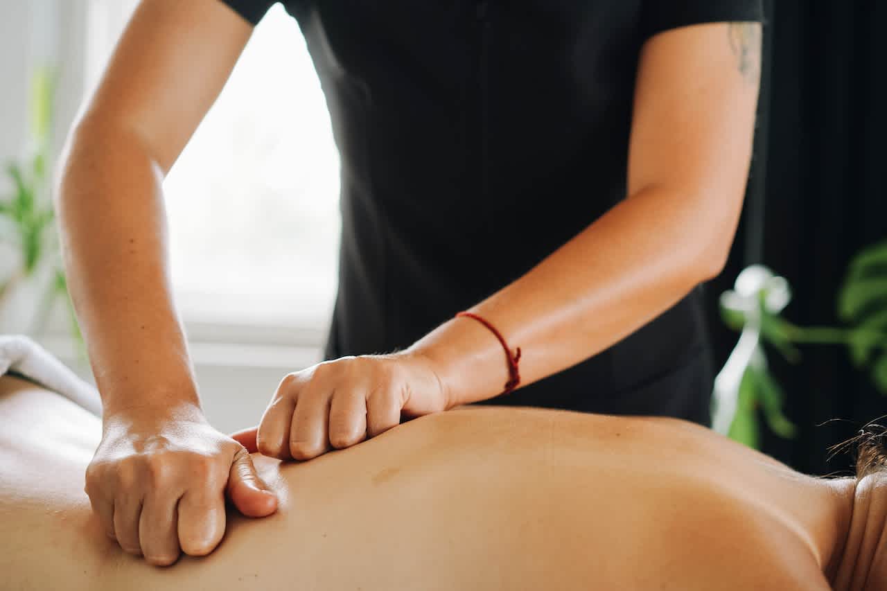 Deep tissue massage on woman's back