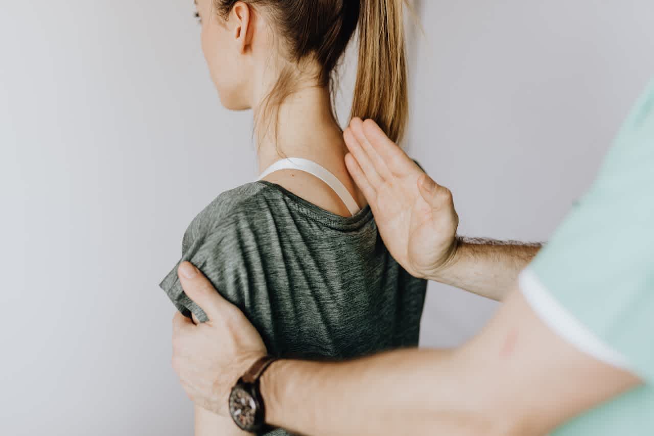 Osteopath working on a female patient's back