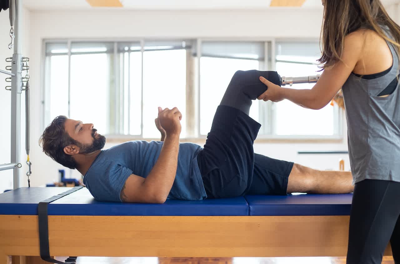 Physiotherapist Assisting Client