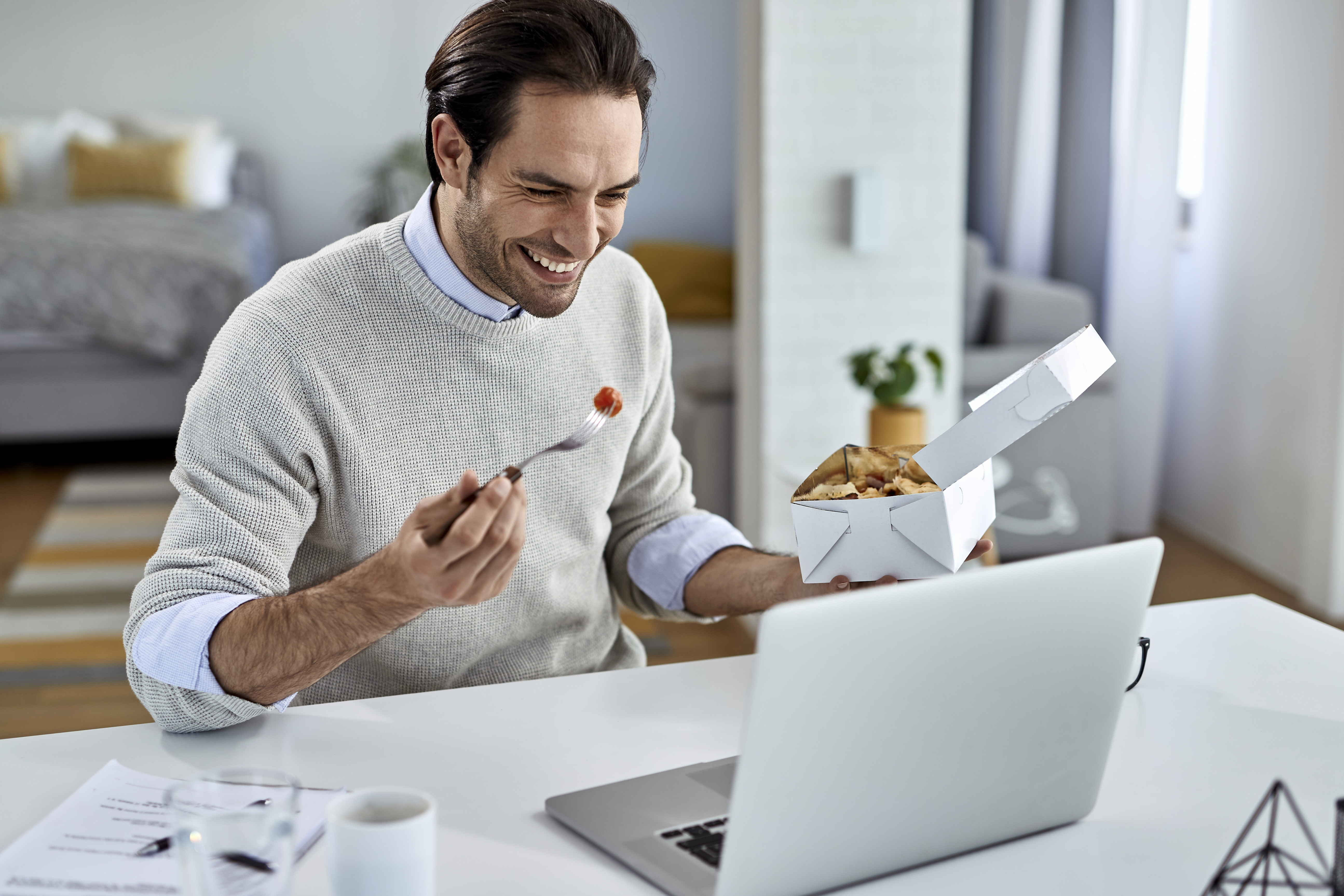 happy-businessman-surfing-the-net-on-laptop-during-2024-12-13-17-08-00-utc