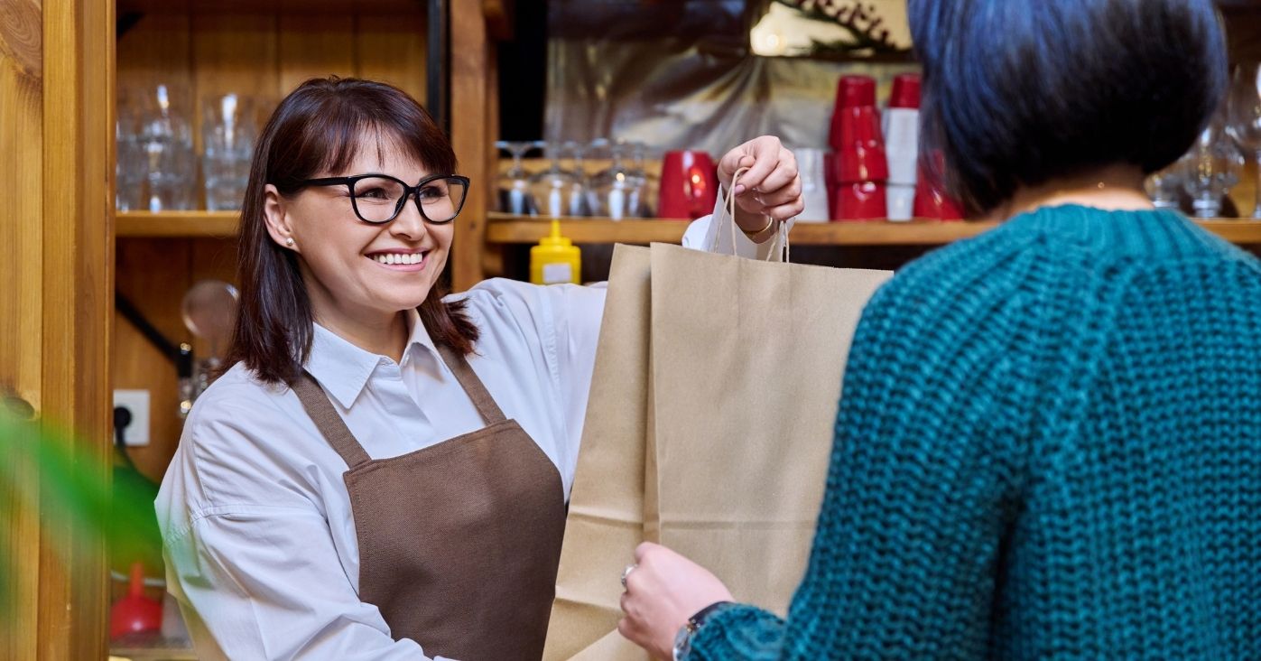woman-restaurant-worker-issuing-an-order-for-takea-2024-12-08-02-39-16-utc