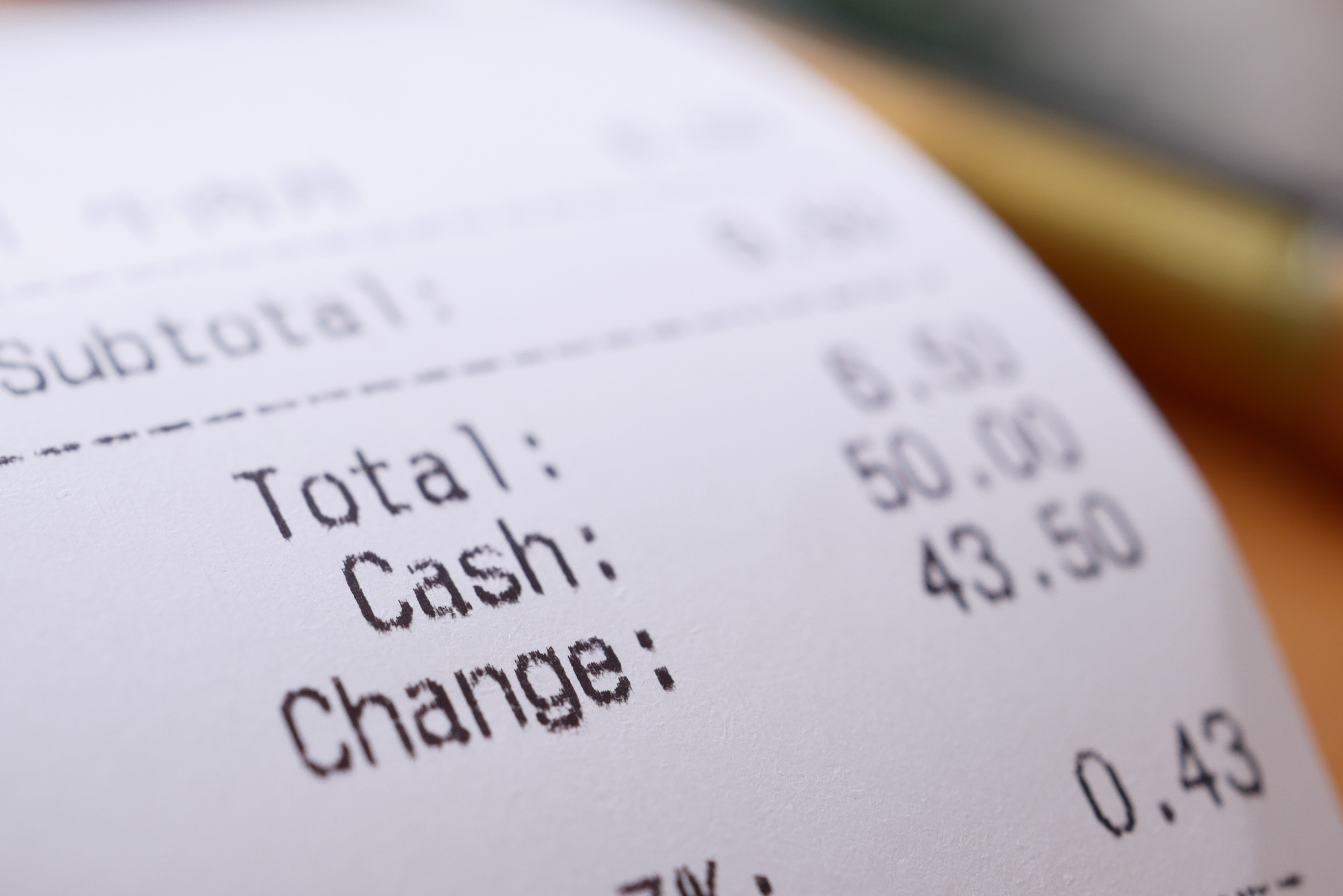 closeup-of-sales-receipts-on-table-2024-12-13-04-38-40-utc