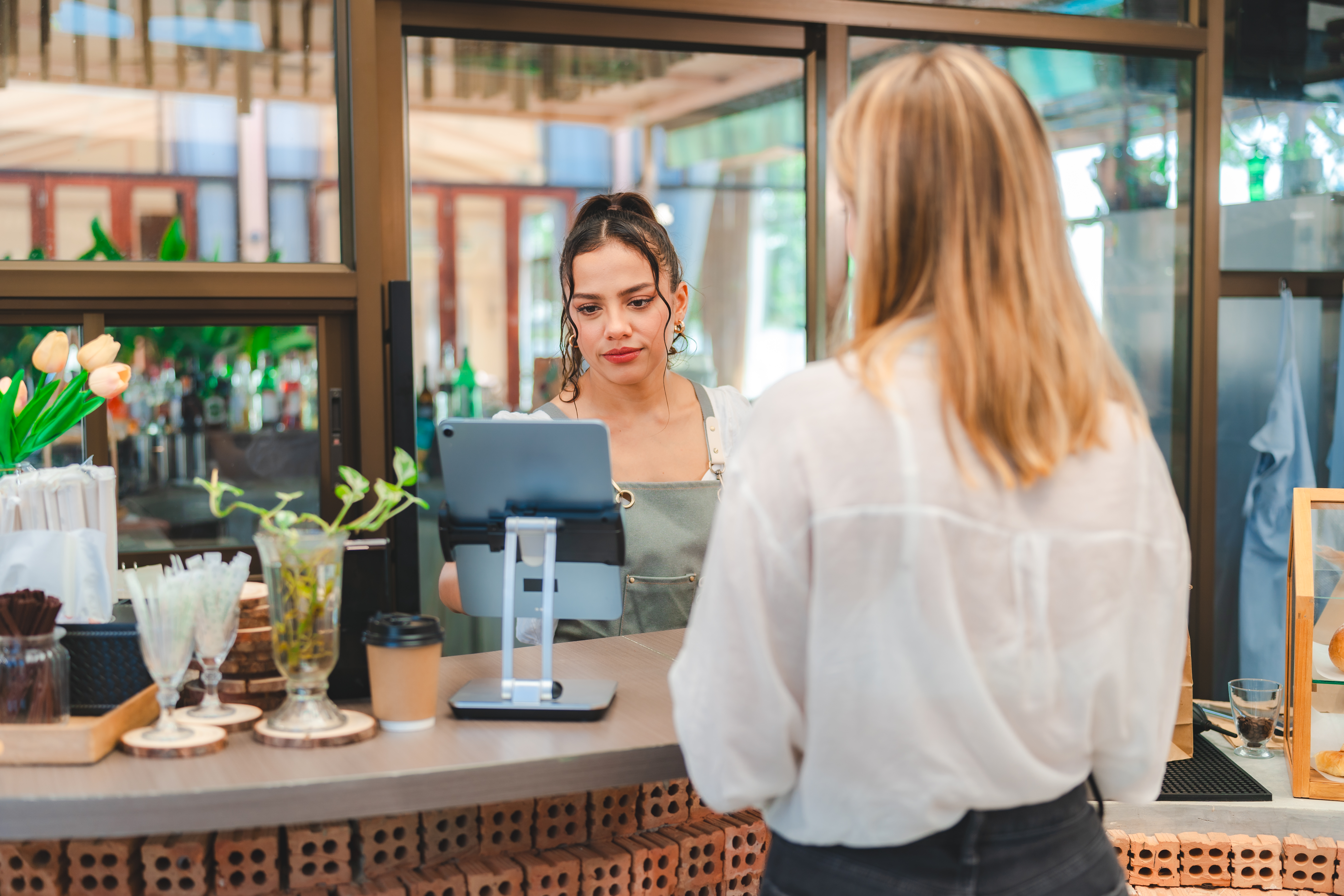 payment-experience-at-cafes-woman-paying-for-her-2025-09-08-23-00-42-utc