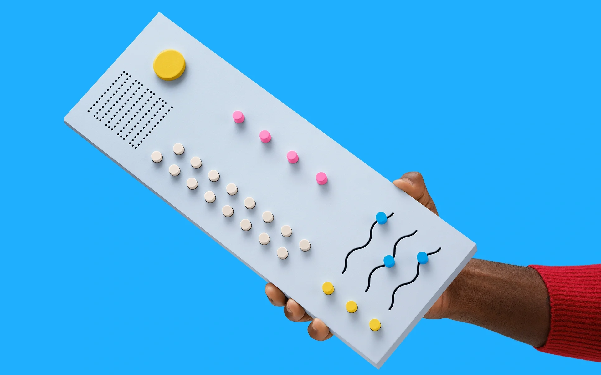 Hand holding a drum machine.