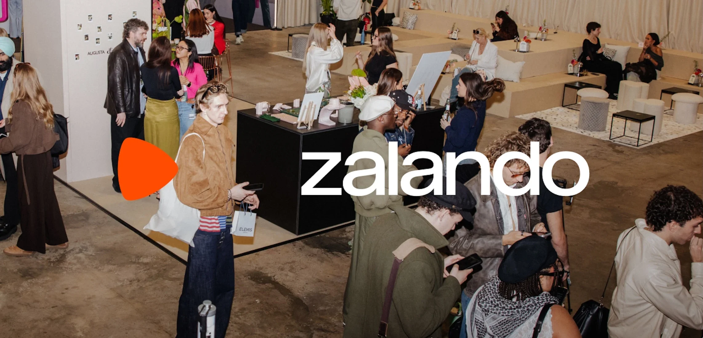 A group of people at an event, with Zalando branding.
