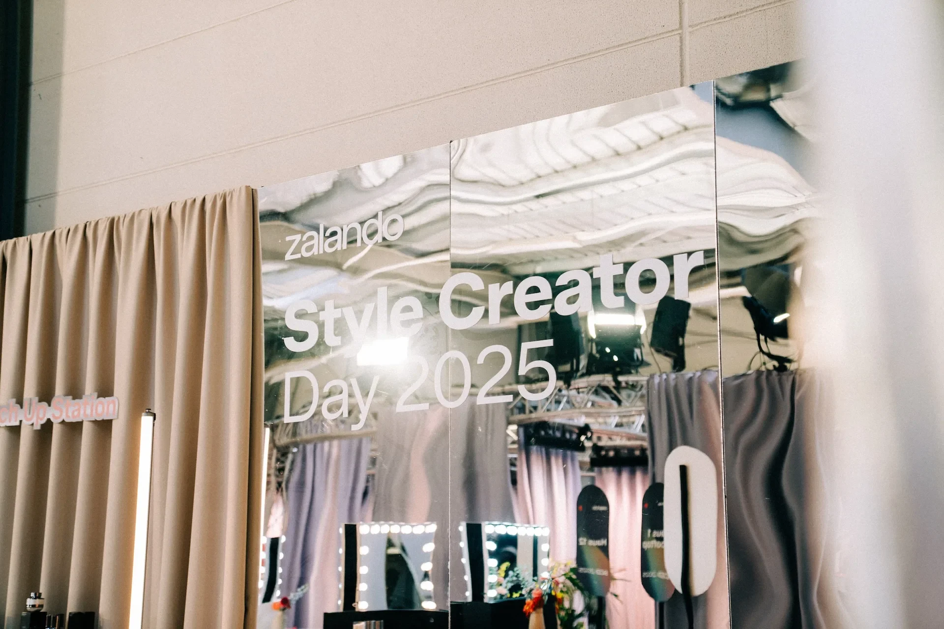 A mirror advertising Zalando’s Style Creator Day 2025