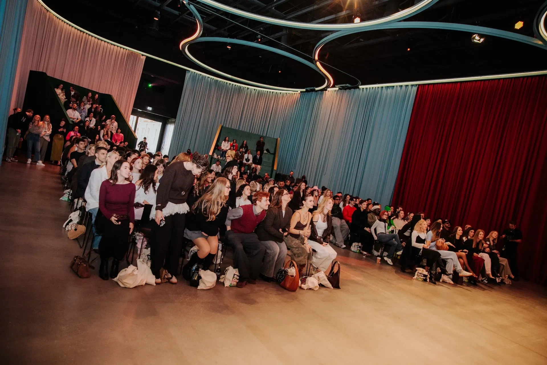 A group of creators sat in a conference hall.