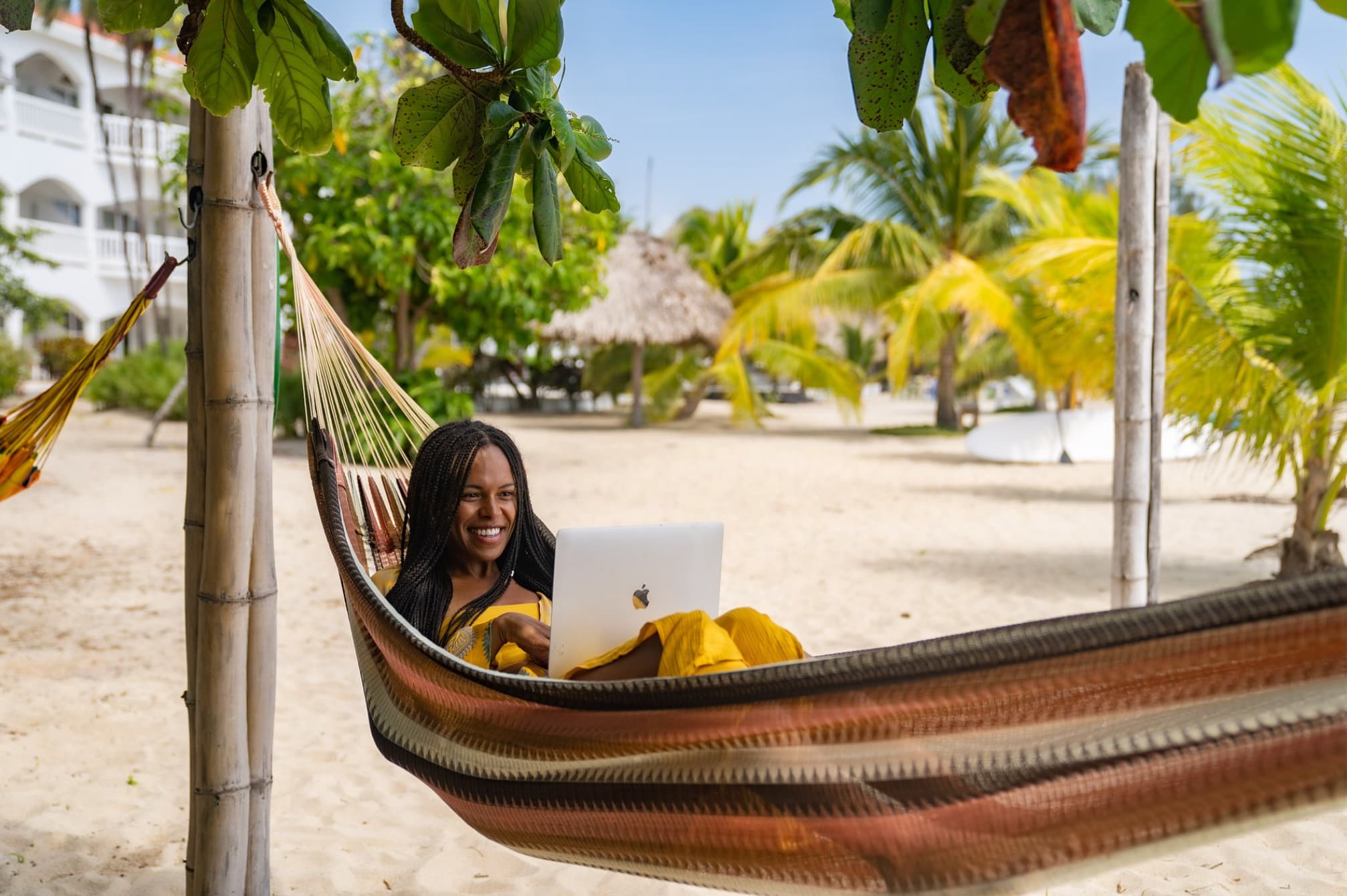 Woman on laptop in hammock