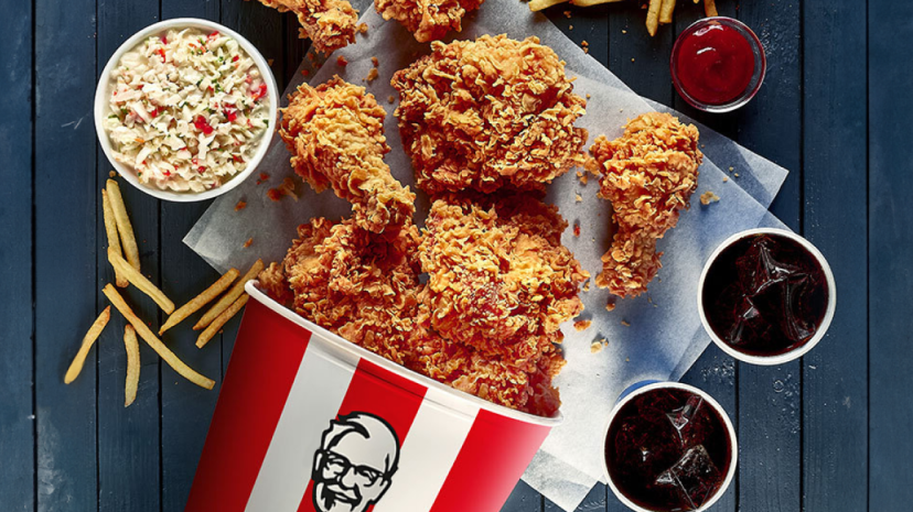 A selection of KFC products on a table viewed from above.